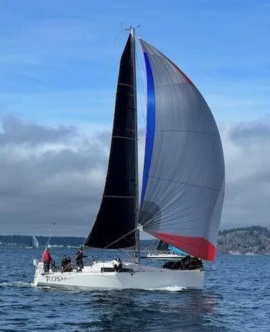 Slide: The Image of 2018 Jeanneau Sun Fast 3600 sailing on open water with colorful spinnaker. - 33