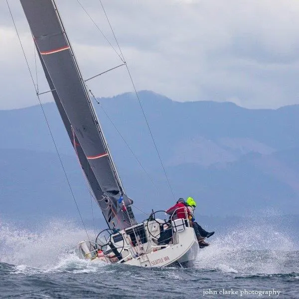 Slide: The Image of 2018 Jeanneau Sun Fast 3600 sailing in rough waters with crew onboard. - 35