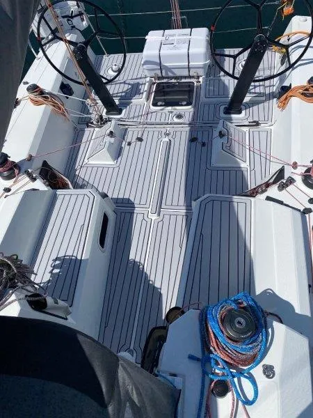 Slide: The Image of 2018 Jeanneau Sun Fast 3600 sailboat deck with dual steering wheels and rigging. - 38