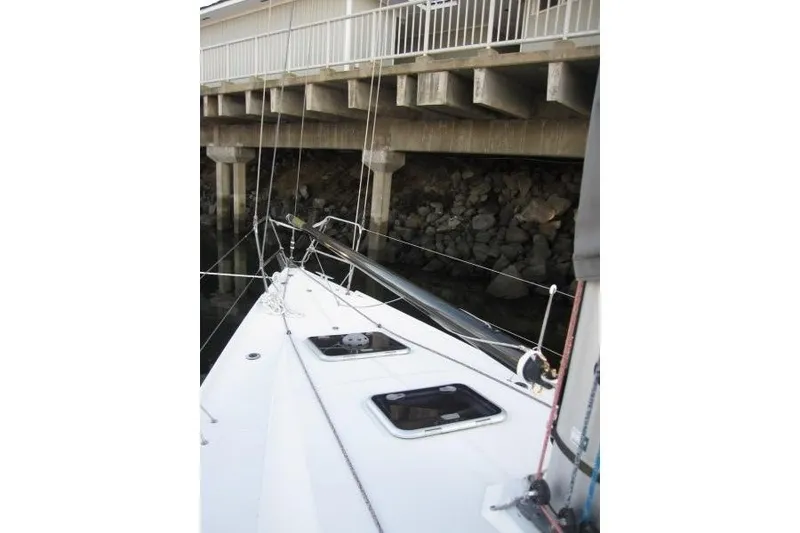 Slide: The Image of 2018 Jeanneau Sun Fast 3600 sailboat docked near a concrete pier. - 48