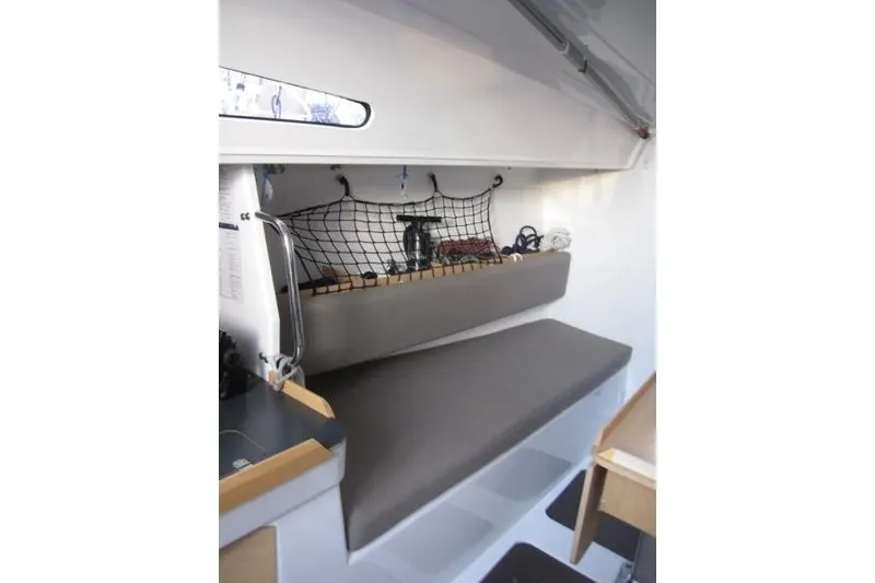 Slide: The Image of Interior of 2018 Jeanneau Sun Fast 3600 sailboat with cushioned seating and storage net. - 60