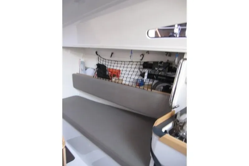 Slide: The Image of 2018 Jeanneau Sun Fast 3600 interior with storage net and seating area. - 61