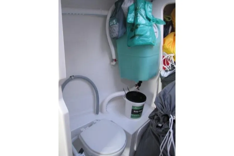 Slide: The Image of Compact bathroom in 2018 Jeanneau Sun Fast 3600 sailboat with storage and toilet. - 63