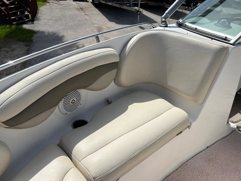 Slide: The Image of 2007 Chaparral 210 SSi boat interior with beige seating and speaker. - 10