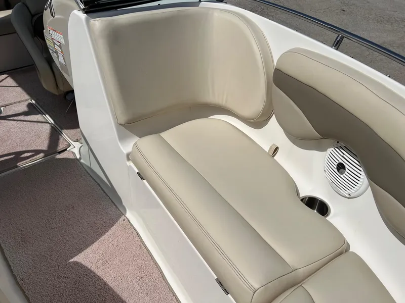 Slide: The Image of 2007 Chaparral 210 SSi boat interior with beige seating and speaker. - 11