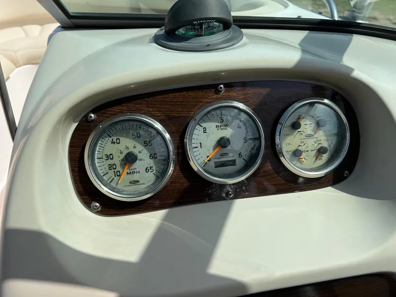 Slide: The Image of Dashboard of a 2007 Chaparral 210 SSi boat with speedometer and gauges. - 16