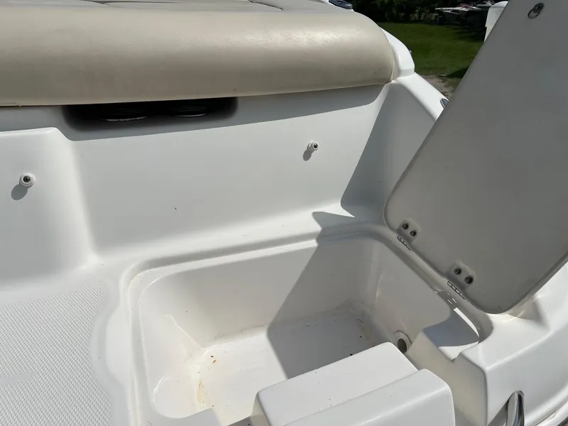 Slide: The Image of Open storage compartment on a 2007 Chaparral 210 SSi boat. - 18