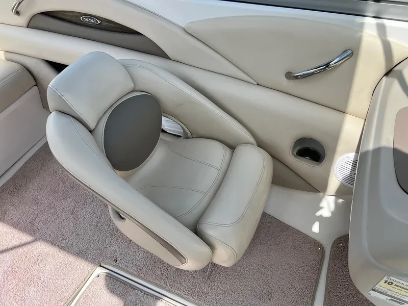 Slide: The Image of 2007 Chaparral 210 SSi boat interior with beige seating and carpet. - 2