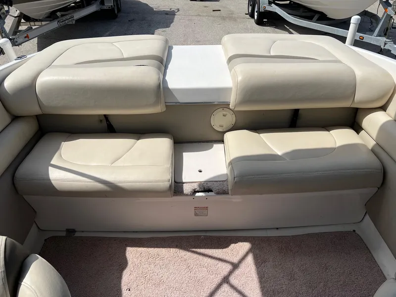 Slide: The Image of 2007 Chaparral 210 SSi boat interior with beige seating and carpeted floor. - 23