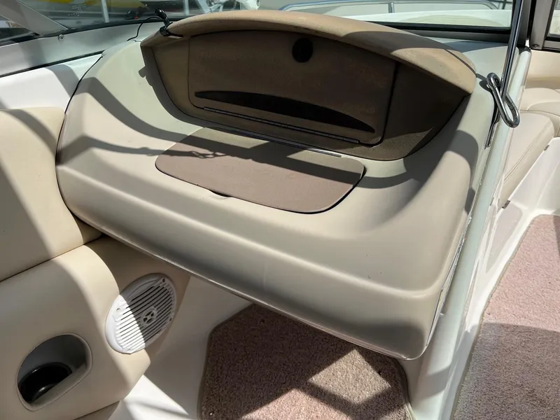 Slide: The Image of 2007 Chaparral 210 SSi boat interior with beige upholstery and speaker detail. - 25