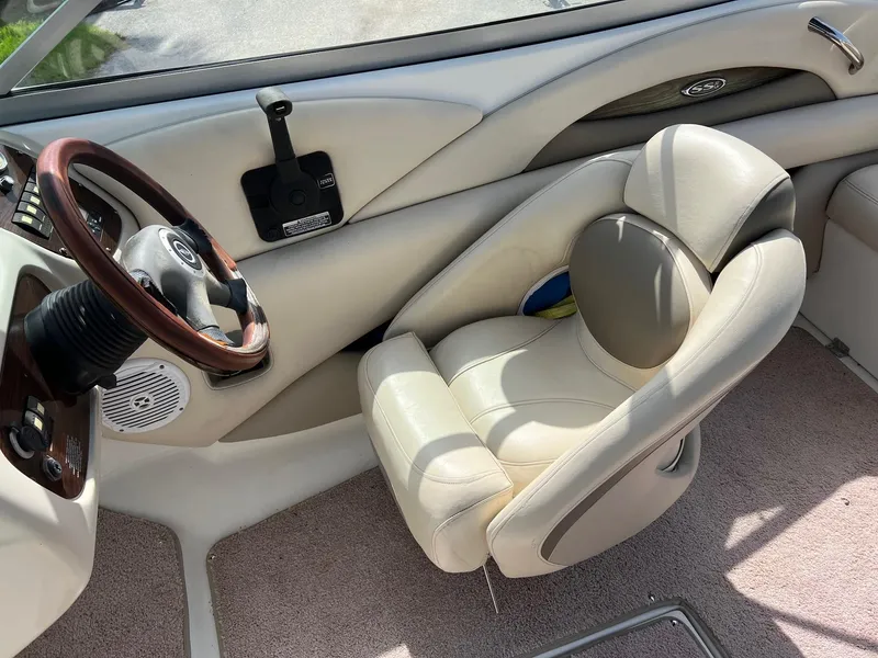Slide: The Image of Interior of 2007 Chaparral 210 SSi boat with steering wheel and plush seating. - 3
