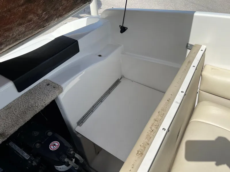 Slide: The Image of 2007 Chaparral 210 SSi boat interior with seating and storage compartment. - 7
