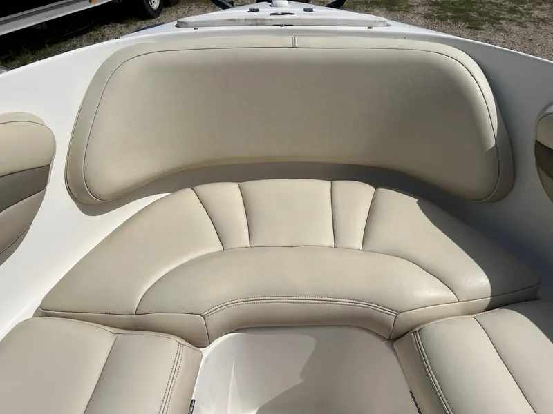Slide: The Image of 2007 Chaparral 210 SSi boat interior with beige cushioned seating. - 9