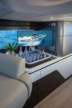 Slide: The Image of Luxurious Schaefer 600 yacht interior with bar and TV, 2026 model. - 11
