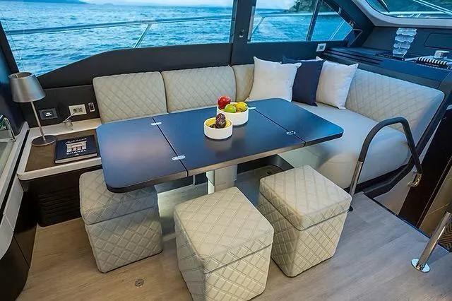 Slide: The Image of Luxurious interior of 2026 Schaefer 600 yacht with elegant seating and ocean view. - 14