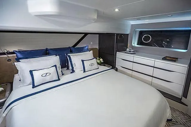 Slide: The Image of Luxurious cabin interior of 2026 Schaefer 600 yacht with elegant bedding and modern furnishings. - 17