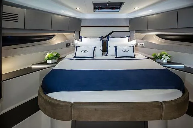 Slide: The Image of Luxurious cabin interior of 2026 Schaefer 600 yacht with elegant bedding and modern design. - 19