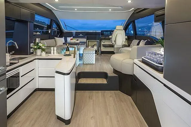 Slide: The Image of Luxurious interior of 2026 Schaefer 600 yacht with modern kitchen and seating area. - 9