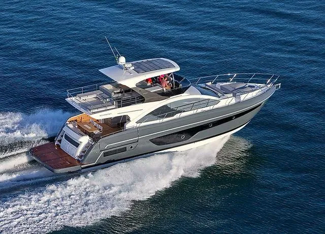 The Image of Luxury Schaefer 660 yacht cruising on open water, 2025 model. - 0