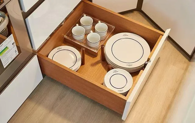 Slide: The Image of Kitchen drawer with neatly organized plates and cups, Schaefer 660, 2025 model. - 11