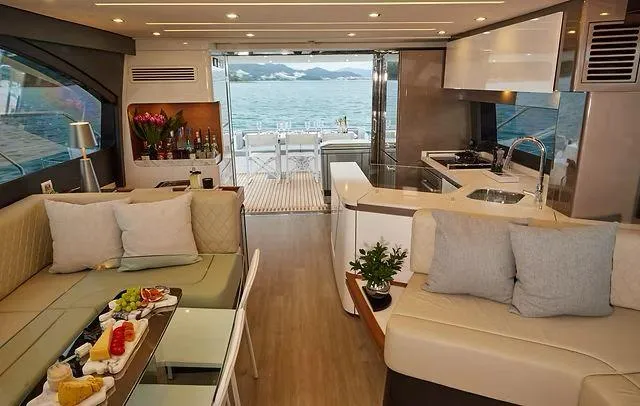 Slide: The Image of Luxurious interior of 2025 Schaefer 660 yacht with modern kitchen and ocean view. - 14