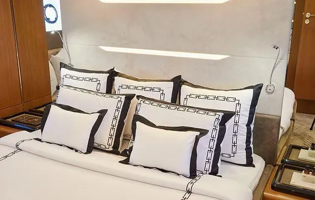 Slide: The Image of Luxurious Schaefer 660 yacht bedroom with elegant bedding, 2025 model. - 18
