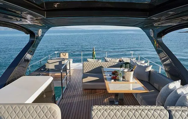 Slide: The Image of Luxurious Schaefer 660 yacht deck with elegant seating, ocean view, and dining setup, 2025 model. - 31