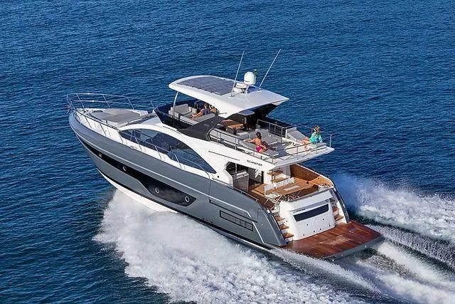 Slide: The Image of Luxury Schaefer 660 yacht cruising on open sea, 2025 model, sleek design, spacious deck. - 5