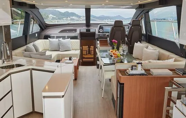 Slide: The Image of Luxurious interior of 2025 Schaefer 660 yacht with modern furnishings and scenic ocean view. - 6