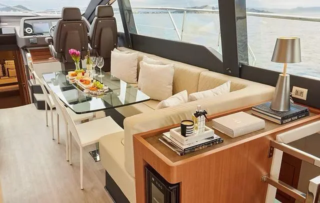 Slide: The Image of Luxurious interior of 2025 Schaefer 660 yacht with elegant dining area and modern decor. - 7