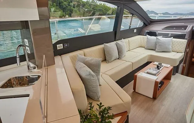 Slide: The Image of Luxurious interior of 2025 Schaefer 660 yacht with elegant seating and scenic ocean view. - 12