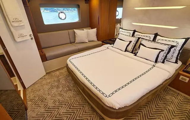 Slide: The Image of Luxurious cabin interior of 2025 Schaefer 660 yacht with elegant bedding and seating. - 17