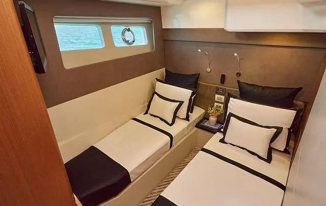 Slide: The Image of Luxurious twin cabin interior on Schaefer 660 yacht, 2025 model, with elegant bedding and ocean view. - 29