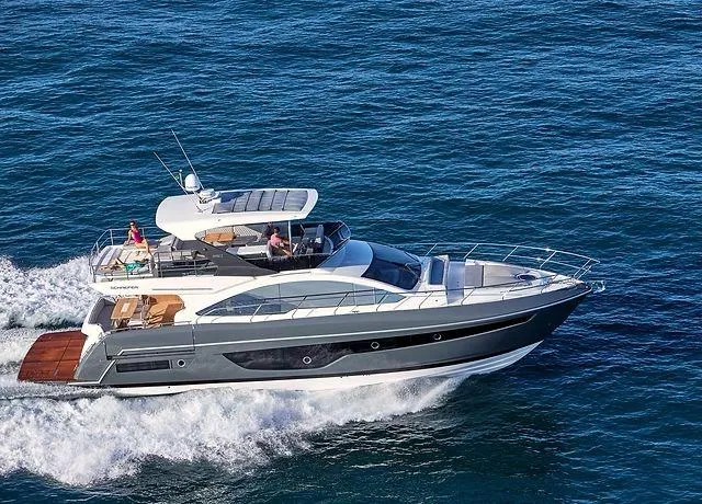 Slide: The Image of Luxury Schaefer 660 yacht cruising on open sea, 2025 model. - 3