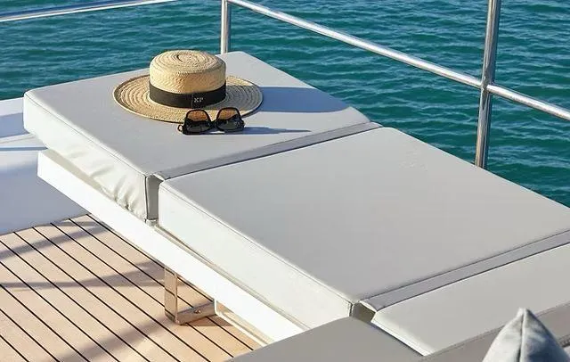 Slide: The Image of Sun hat and sunglasses on yacht deck, Schaefer 660, 2025 model, overlooking ocean. - 34