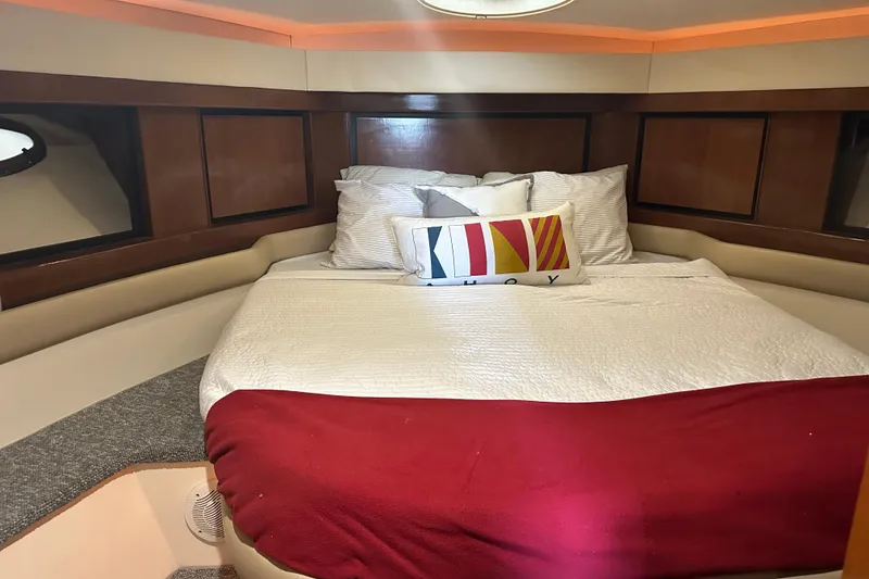 Slide: The Image of Luxurious cabin interior of 1998 Trojan 440 Express yacht with cozy bedding. - 17