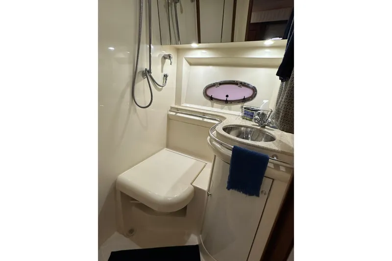 Slide: The Image of Bathroom interior of 1998 Trojan 440 Express yacht with shower and sink. - 25