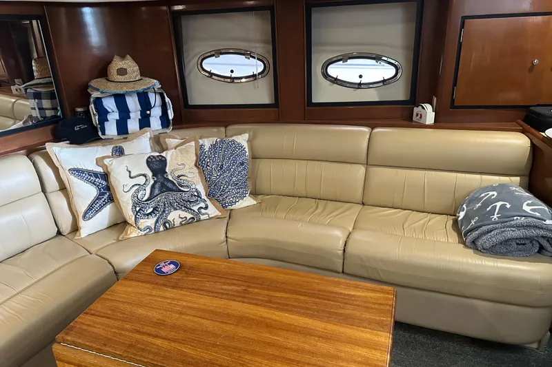 Slide: The Image of Luxurious interior of 1998 Trojan 440 Express yacht with nautical-themed decor. - 7