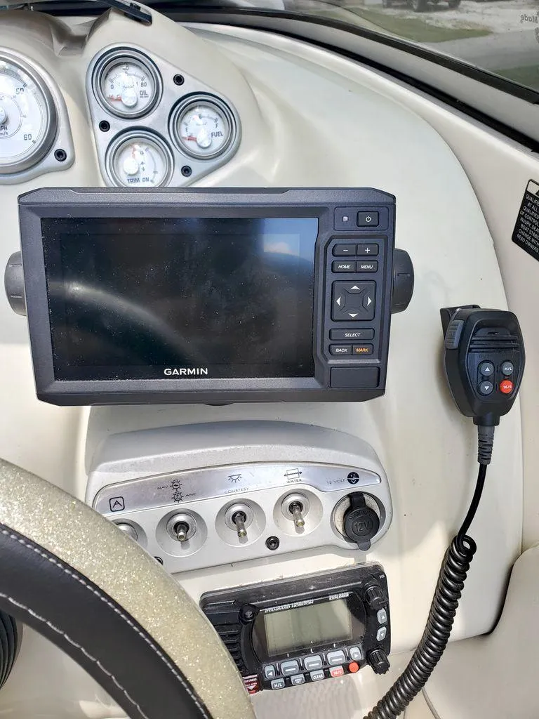 Slide: The Image of 2006 Maxum SC3 boat on trailer in warehouse. - 10