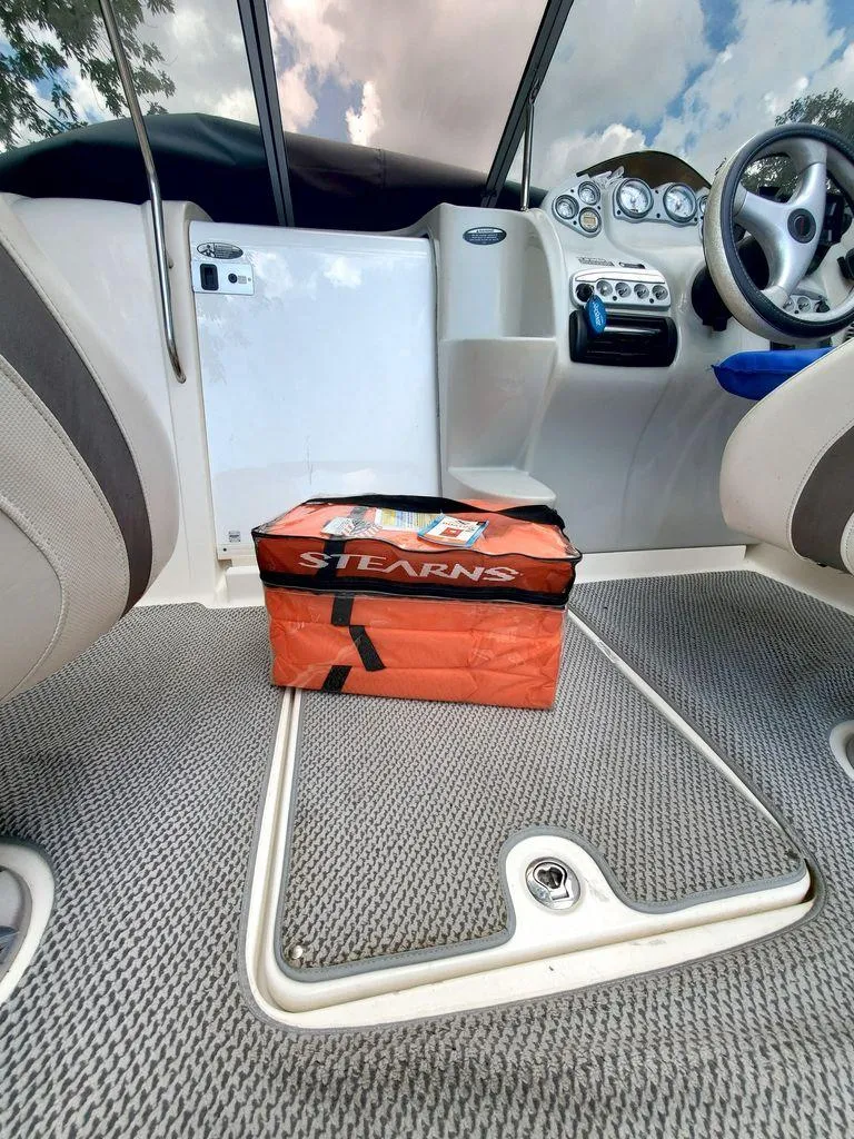 Slide: The Image of Interior of a 2006 Maxum SC3 yacht with cushioned seating. - 5