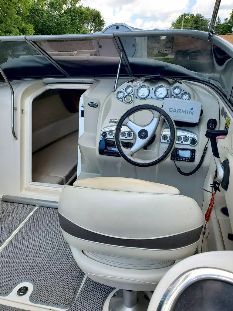 Slide: The Image of 2006 Maxum SC3 boat on trailer under tree. - 8