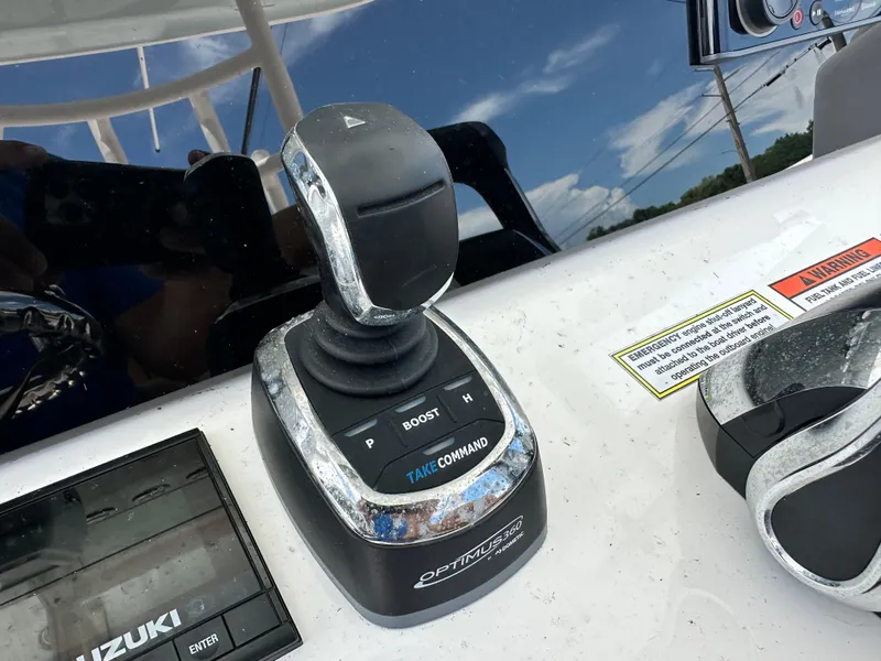 Slide: The Image of Joystick control on 2023 Twin Vee 340 GFX CC boat dashboard, featuring Optimus 360 system. - 13