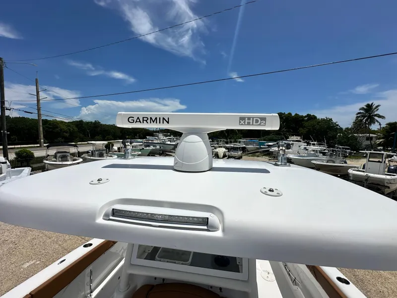 Slide: The Image of 2023 Twin Vee 340 GFX CC boat with Garmin xHD2 radar under clear blue sky. - 15