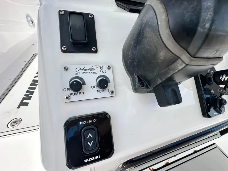 Slide: The Image of Control panel of 2023 Twin Vee 340 GFX CC boat with Suzuki troll mode. - 19