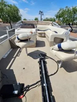 Slide: The Image of 2008 Sun Tracker FISHING BARGE 21 with seating and fishing equipment on deck. - 4