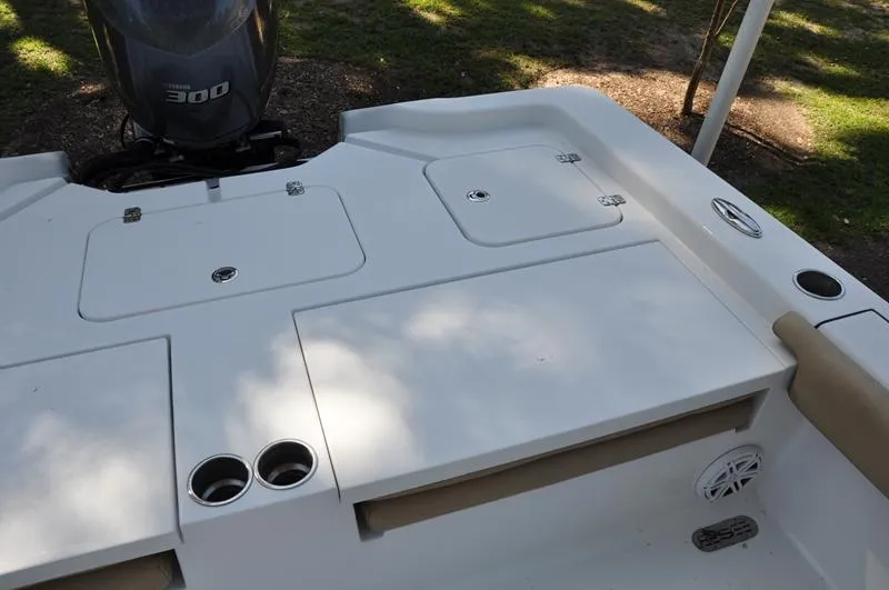 Slide: The Image of 2019 Sportsman Masters 267 Bay Boat deck with storage compartments and Yamaha 300 engine. - 10