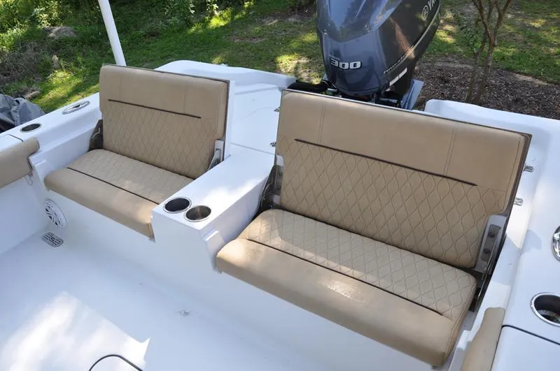 Slide: The Image of 2019 Sportsman Masters 267 Bay Boat with tan seating and Yamaha 300 engine. - 11