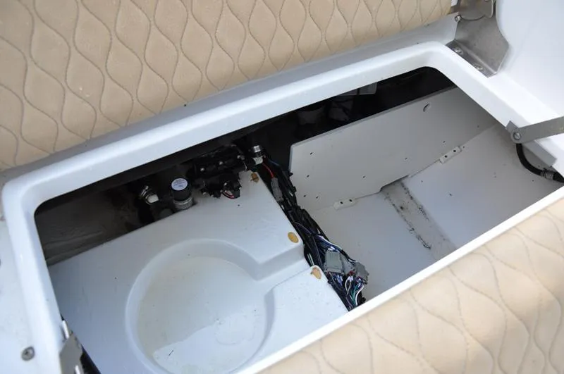 Slide: The Image of 2019 Sportsman Masters 267 Bay Boat storage compartment with wiring and components. - 12