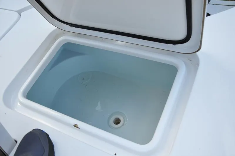 Slide: The Image of Open storage compartment on 2019 Sportsman Masters 267 Bay Boat. - 14