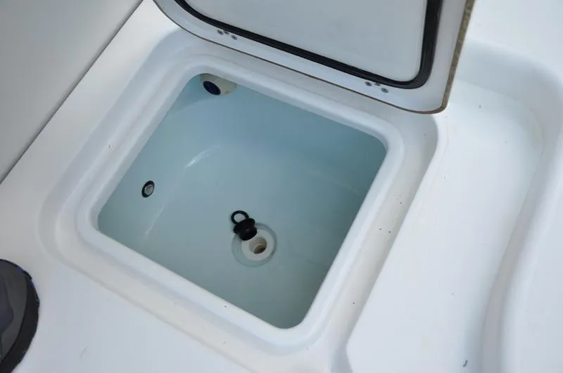 Slide: The Image of Open storage compartment on 2019 Sportsman Masters 267 Bay Boat. - 16